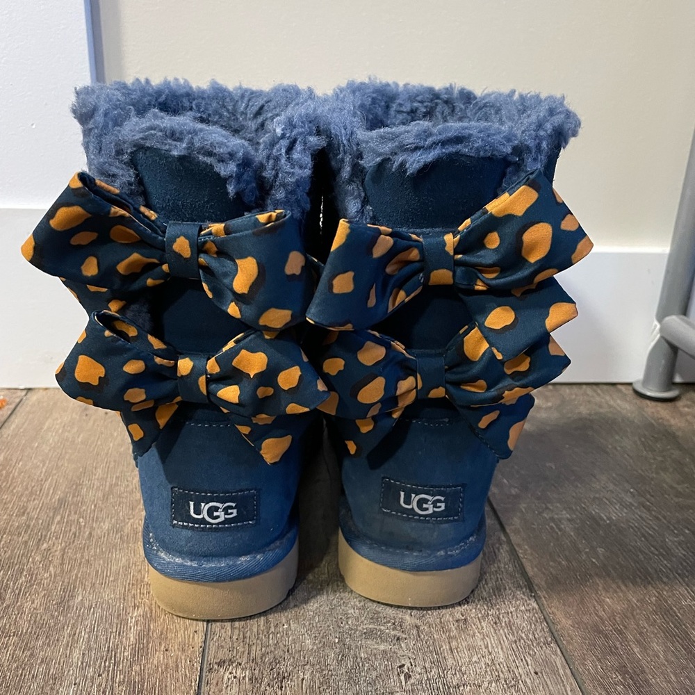Rare, Excellent used condition Bailey Ugg boots with blue and yellow bows.